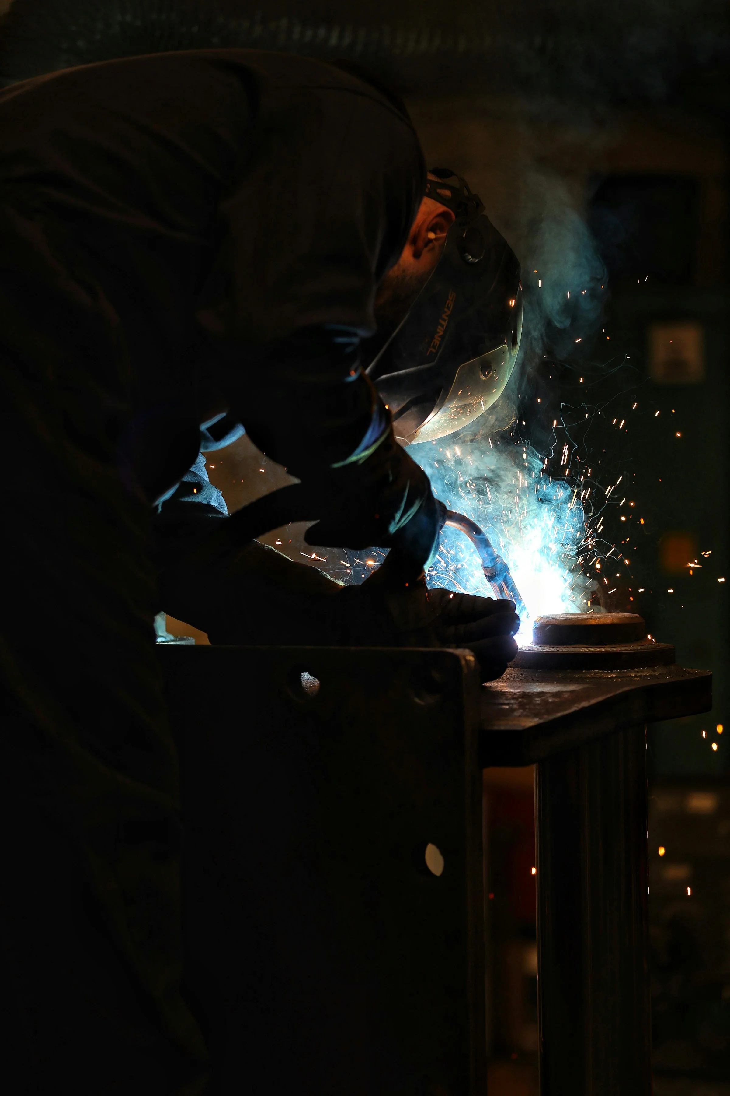 Contractor welding on a fabricated steel assembly