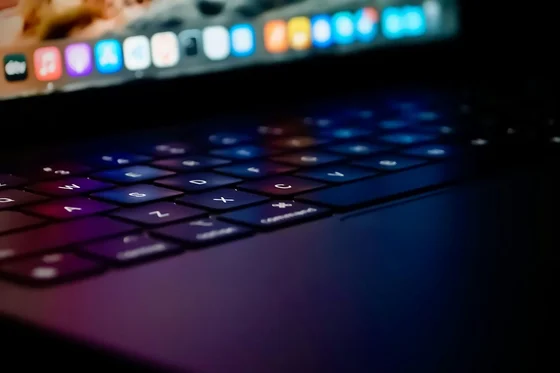 Close-up of a backlit laptop keyboard